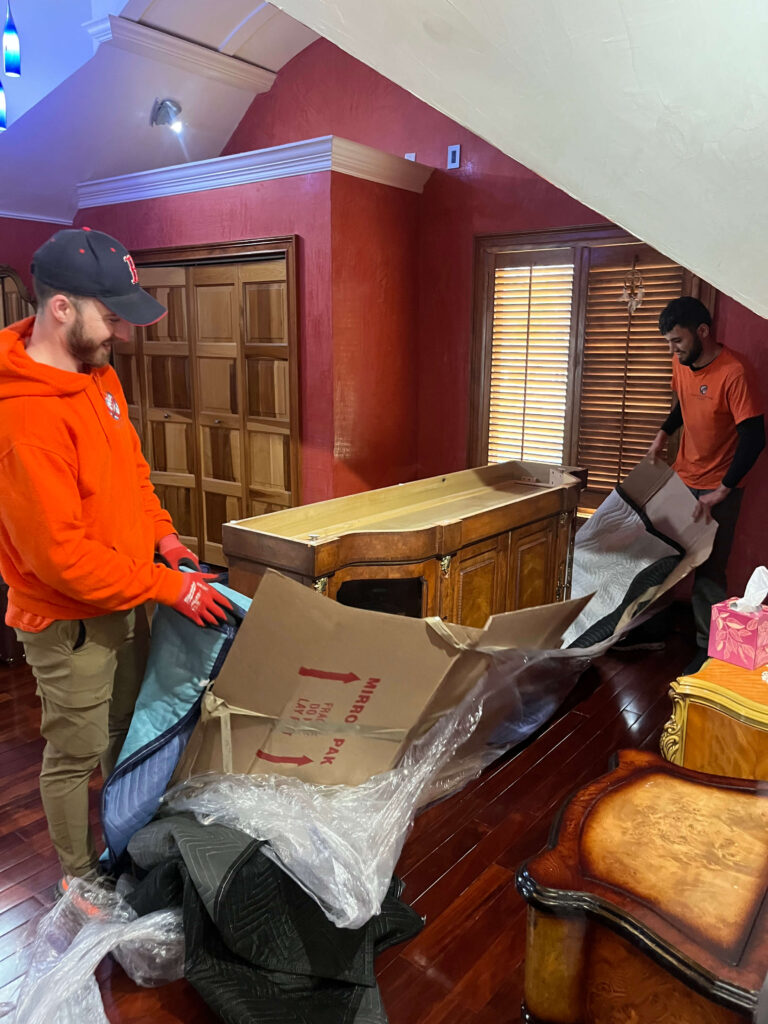 Packing services in Boston, MA with labeled boxes, bubble wrap, and fragile protection